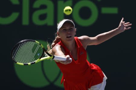 Mar 30, 2017; Miami, FL, USA; Caroline Wozniacki of Denmark hits a forehand against Karoilina Pliskova of the Czech Republic (not pictured) in a women's singles semi-final during the 2017 Miami Open at Crandon Park Tennis Center. Geoff Burke-USA TODAY Sports