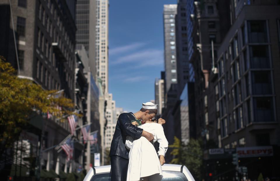 Statue re-creating famous image of sailor kissing nurse on VJ Day in New York's Times Square, rides on a float in the York City Veterans Day parade on 5th Avenue in New York