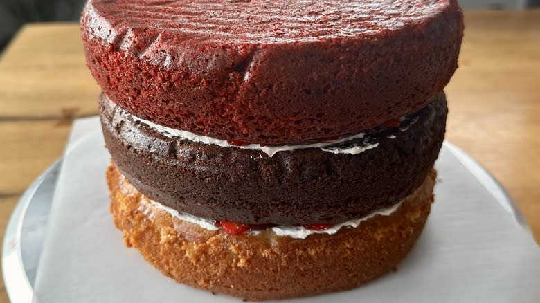 three stacked cakes with layers