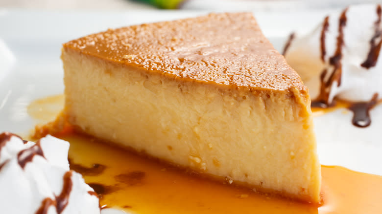 close up of a slice of flan on a plate