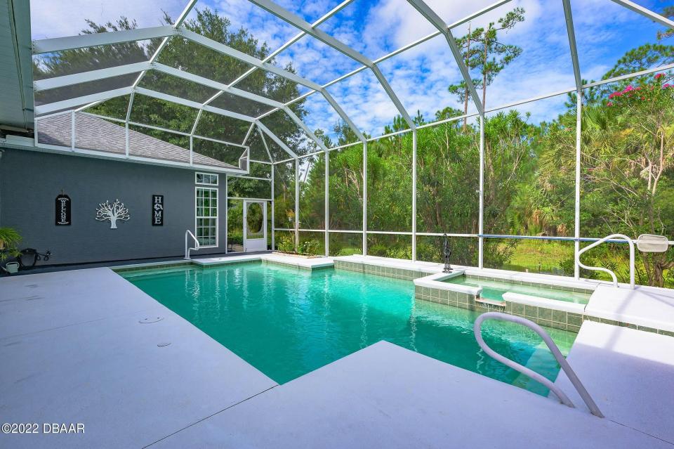 The pool, spa and the spacious lanai can be accessed by cascading sliding doors.