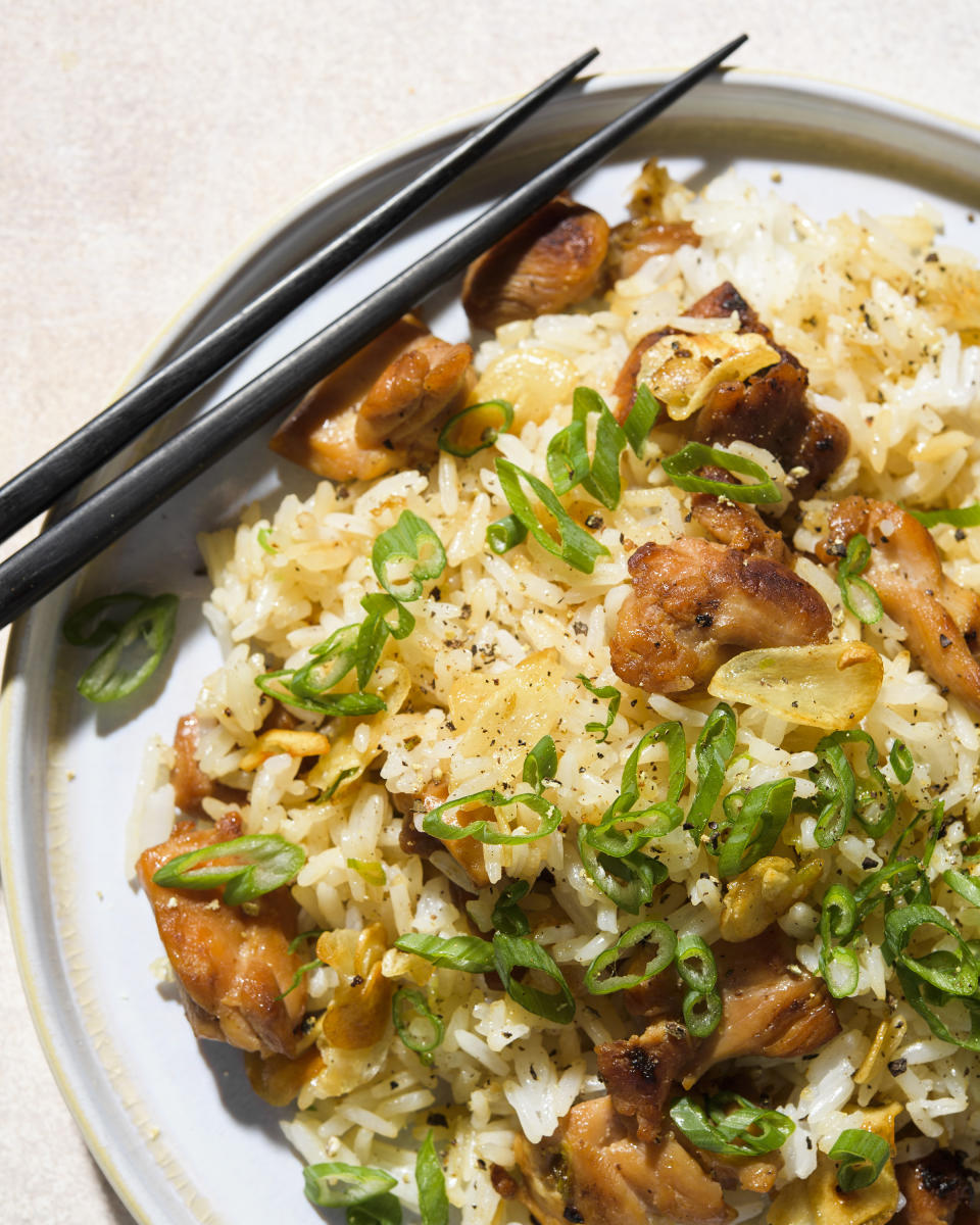 This image released by Milk Street shows a recipe for Garlic Fried Rice w/Chicken. (Milk Street via AP)