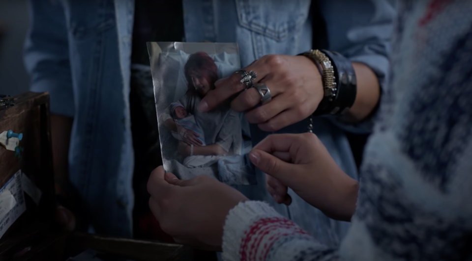 Lilan Bowden points to a younger picture of herself holding her daughter in "Andi Mack"