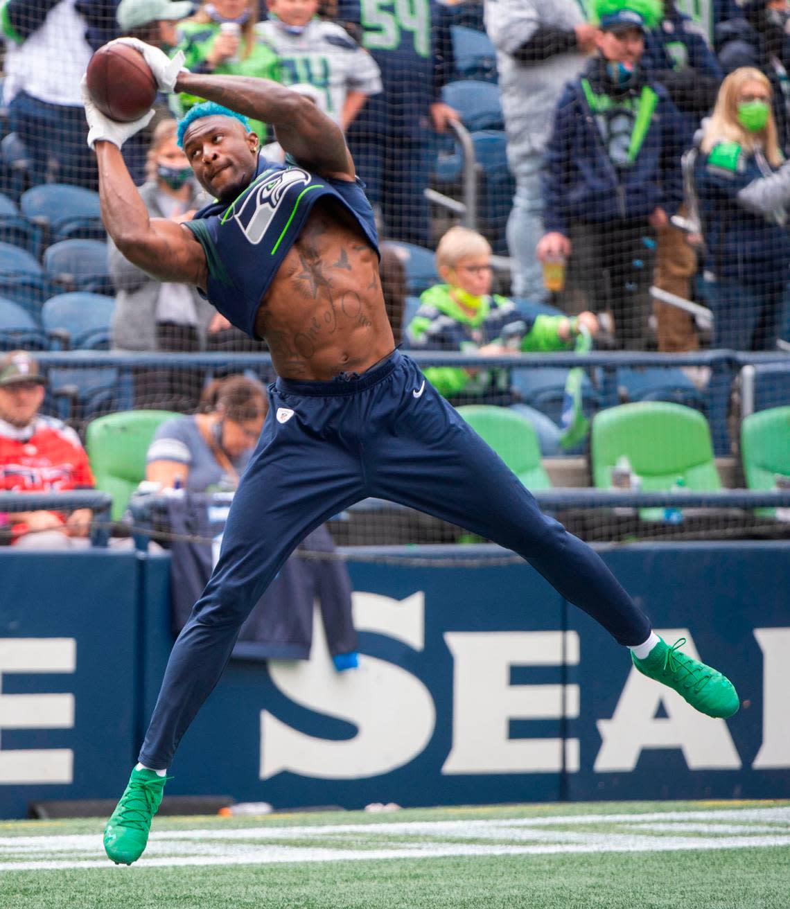 Pro Bowl wide receiver DK Metcalf warms up prior to the Seattle Seahawks playing the Tennessee Titans in an NFL football game at Lumen Field in Seattle, Wash., on Sunday, Sept. 19, 2021.