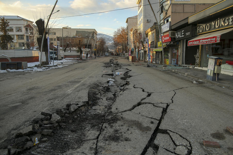 A damaged road in Golbasi, in Adiyaman province, southern Turkey, Wednesday, Feb. 8, 2023. Thinly stretched rescue teams worked through the night in Turkey and Syria, pulling more bodies from the rubble of thousands of buildings toppled by a catastrophic earthquake. The death toll rose Wednesday to more than 10,000, making the quake the deadliest in more than a decade. (AP Photo/Emrah Gurel)