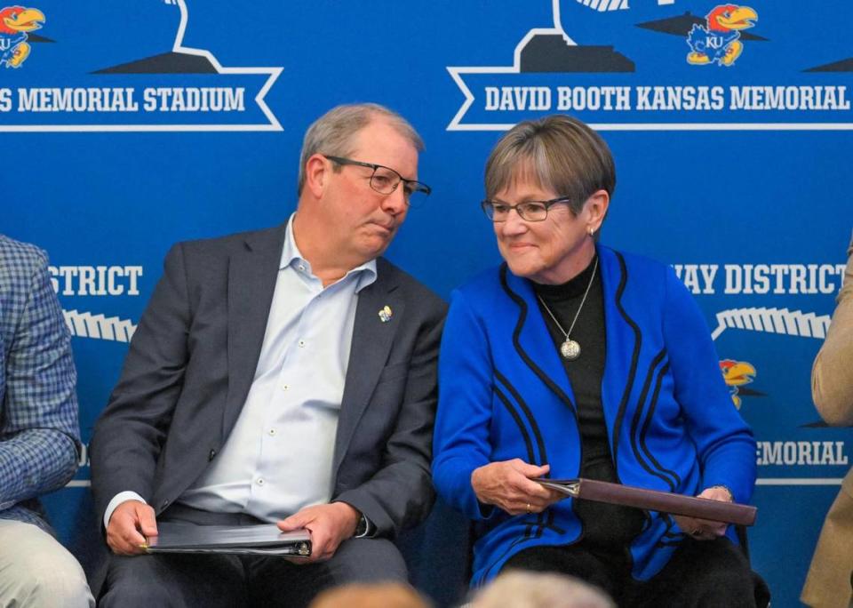 Chancellor Douglas Girod, left, speaks with Kansas Gov. Laura Kelly before Kelly addressed the crowd as the University of Kansas and Kansas Athletics revealed plans Wednesday, Aug. 15, 2023, for a $300 million renovation to David Booth Kansas Memorial Stadium and a campus Gateway Project in Lawrence.