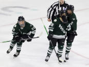Boston forward Hannah Brandt, left, forward Amanda Pelkey, center, and defender Jessica Digirolamo, right, celebrate a goal by Brandt against Montreal during the third period of a PWHL playoff hockey game Tuesday, May 14, 2024, in Lowell, Mass. (AP Photo/Mark Stockwell)