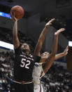 South Carolina's Tyasha Harris (52) goes up for a basket as Connecticut's Megan Walker (3) defends during the first half of an NCAA college basketball game, Monday, Feb. 11, 2019, in Hartford, Conn. (AP Photo/Jessica Hill)