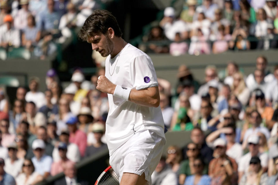 Britain's Cameron Norrie celebrates winning a point against Tommy Paul of the US during a men's fourth round singles match on day seven of the Wimbledon tennis championships in London, Sunday, July 3, 2022. (AP Photo/Alberto Pezzali)