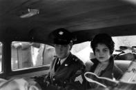 Not originally published in LIFE. Elvis and Priscilla leave the house he and his family occupied in Bad Nauheim, Germany, March 1960. (James Whitmore—Time & Life Pictures/Getty Images) <br> <br> <a href="http://life.time.com/culture/elvis-presley-life-photos-of-the-king-leaving-the-army-march-1960/#1" rel="nofollow noopener" target="_blank" data-ylk="slk:Click here to see the full collection at LIFE.com;elm:context_link;itc:0;sec:content-canvas" class="link ">Click here to see the full collection at LIFE.com</a>