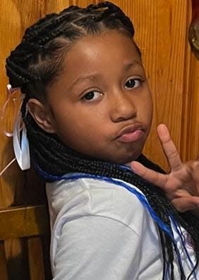 P'Aris Mi-Unique Angel Moore, 8, was shot to death Dec. 30 as she played in the front yard of her Hopewell residence.