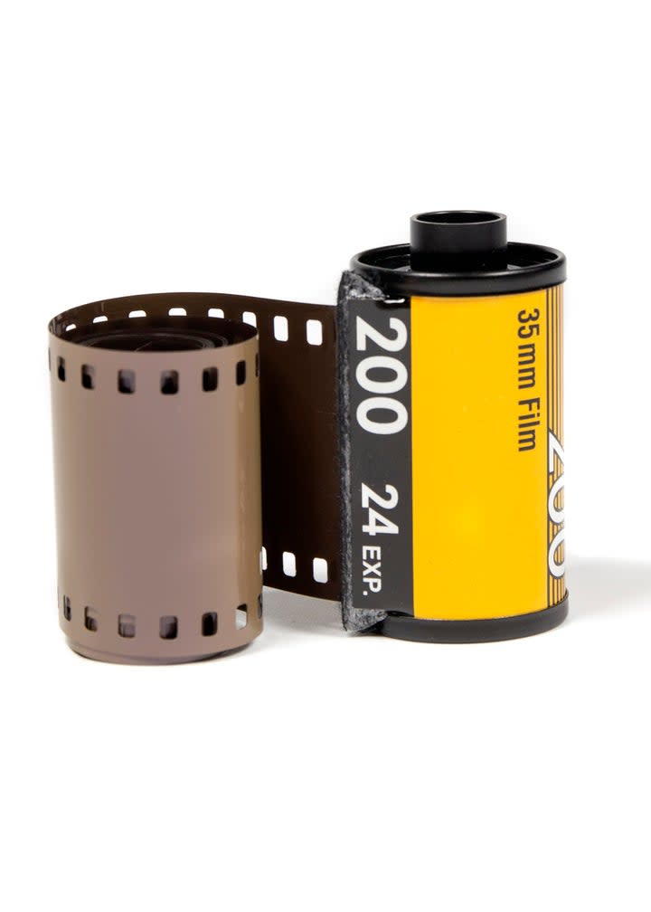 35mm film roll and a canister isolated on a white background, related to photography