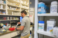 Pharmacy technician Eduardo Sanchez fills prescriptions at Alliance Medical Center in Healdsburg, Calif., Wednesday, May 29, 2024. When the facility lost power during the 2017 Tubbs fire, the staff couldn’t access electronic health records or fill prescriptions. (AP Photo/Nic Coury)