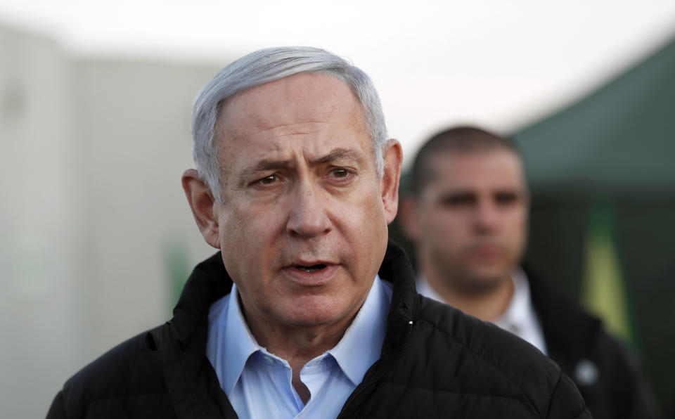 FILE - in this Nov. 24, 2019 file photo, Israeli Prime Minister Benjamin Netanyahu, looks on during a visit to Israeli army base in the Golan Heights located on the Israeli-Syrian border. Barring a nearly unfathomable about face, Israel is headed Wednesday, Dec. 11 toward an unprecedented third election within a year - prolonging a political stalemate that has paralyzed government and undermined its citizens' faith in the democratic process. (AP Photo/Atef Safadi, File)