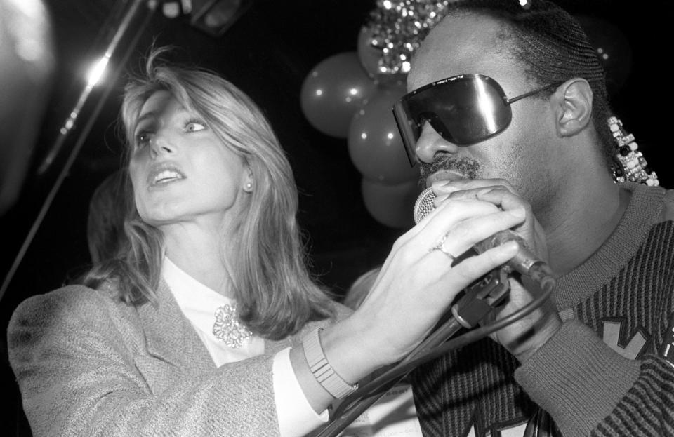 Musician Stevie Wonder with British television presenter Selina Scott at Stringfellows nightclub