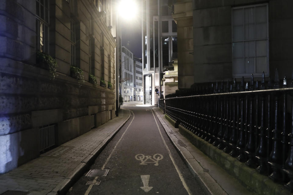 A view of an empty Gutter Lane in the City of London on Saturday, March 6, 2021. When the pandemic struck, about 540,000 workers vanished from London's financial hub almost overnight. The area known as "the City" became a ghost town as many people began working from home. A year on, most haven't returned to the business hub. While many people believe that post-pandemic workflow will become the new normal, skyscrapers are still rising, and city planners say they aren't worried about empty office blocks. (AP Photo/Alastair Grant)