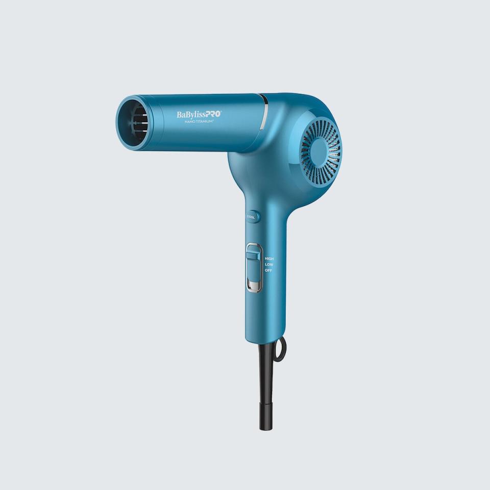 blue hairdryer against light blue background