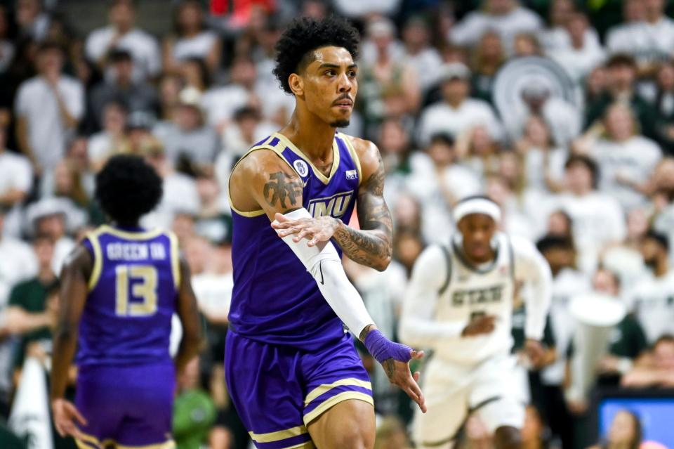 James Madison's Terrence Edwards, Jr. celebrates after a 3-pointer against Michigan State during the first half on Monday, Nov. 6, 2023, in East Lansing.