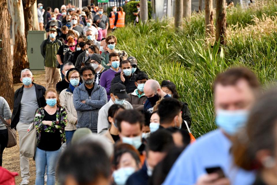 People queuing up with face masks on during the Covid pandemic.