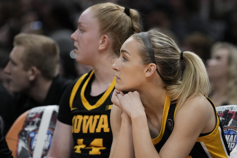 Iowa guard Kylie Feuerbach sits on the bench during the second half of the Final Four college basketball championship game against South Carolina in the women's NCAA Tournament, Sunday, April 7, 2024, in Cleveland. (AP Photo/Morry Gash)