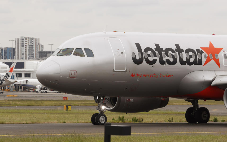 A Jetstar plane prepares to take off at Kingsford Smith International Airport in Sydney.