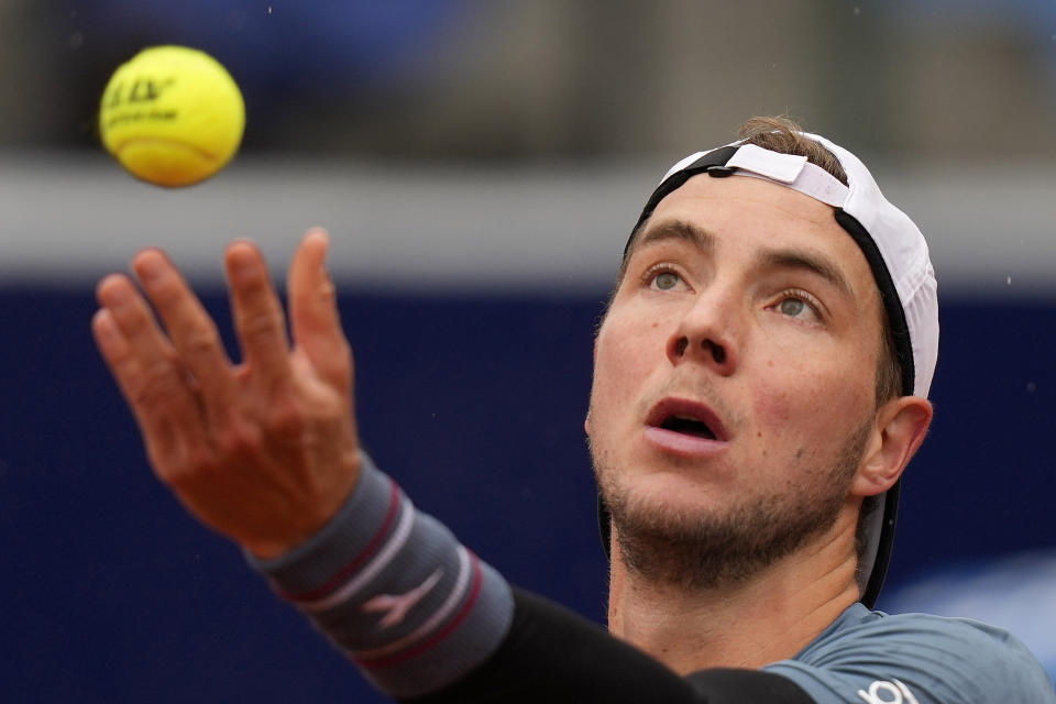 Jan-Lennard Struff of Germany serves the ball during the final match against Taylor Fritz of the United States at the Tennis ATP tournament in Munich, Germany, Sunday, April 21, 2024. (AP Photo/Matthias Schrader)