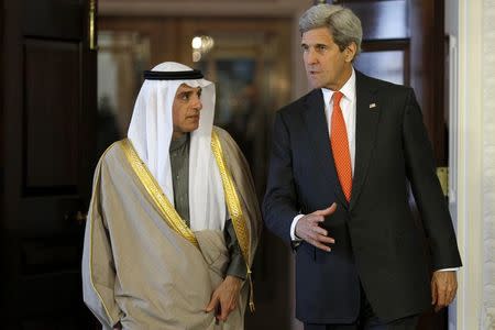 U.S. Secretary of State John Kerry (R) and Saudi Foreign Minister Adel al-Jubeir walk out of a room after a meeting at the State Department in Washington, February 8, 2016. REUTERS/Carlos Barria