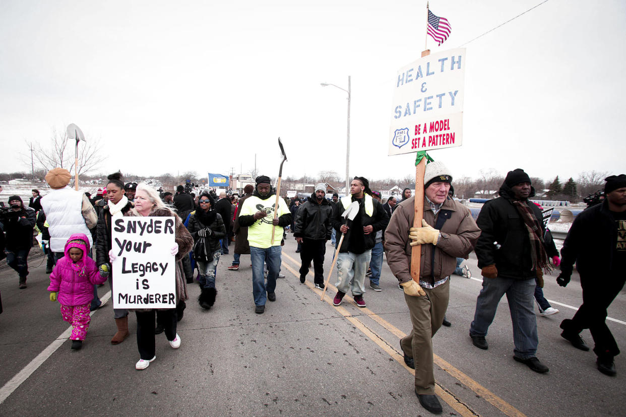 People participate in a national mile-long march to highlight the push for clean water in Flint (Bill Pugliano / Getty Images file)