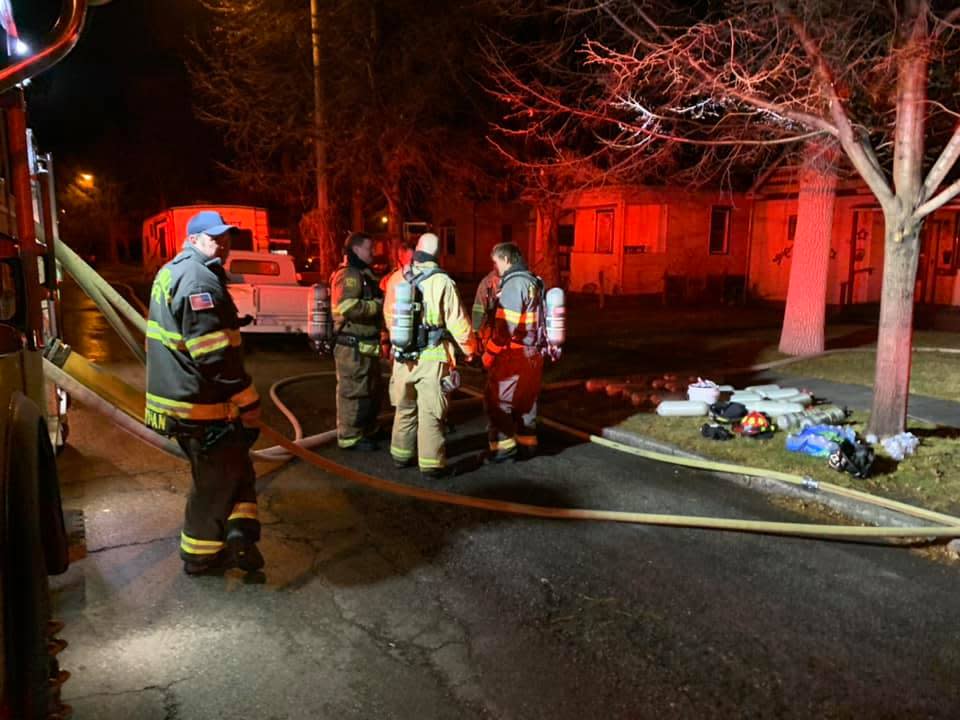 Firefighters work at the scene of an early morning house fire in Great Falls house in 2021.