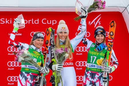 Dec 6, 2015; Lake Louise, Alberta, Canada; Second place finisher Tamara Tippler of Austria (left) and first place finisher Lindsey Vonn of the United States (middle) and third place finisher Cornelia Huetter of Austria (right) take the podium during the women's Super G race in the FIS alpine skiing World Cup at Lake Louise Ski Resort. Mandatory Credit: Sergei Belski-USA TODAY Sports