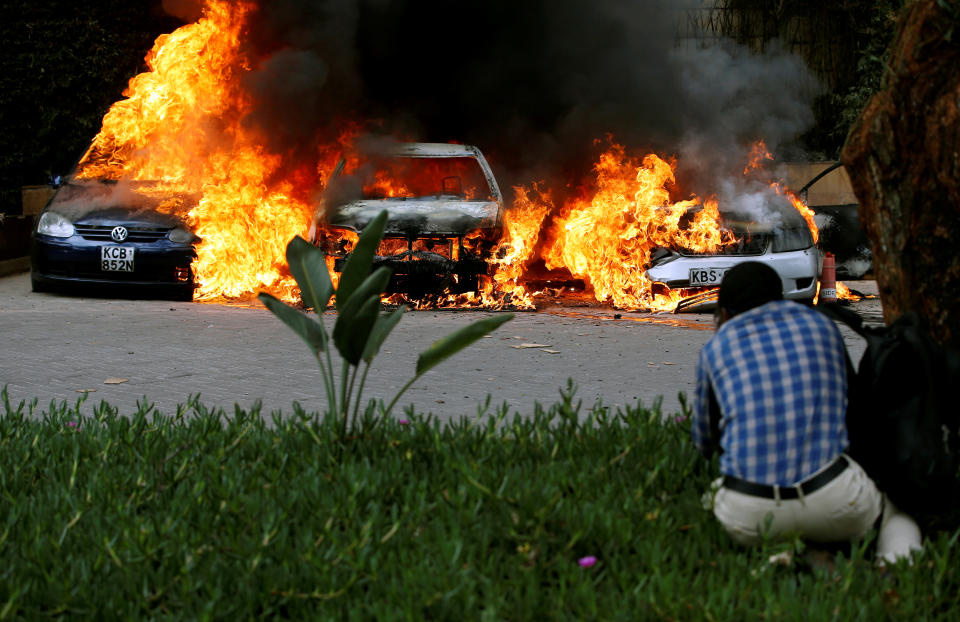 Cars burn at the scene of explosions and gunshots in Nairobi, Kenya, Jan.15, 2019. (Photo: Thomas Mukoya/Reuters)