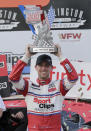 ADD HAMLIN STRIPPED OF WIN - Denny Hamlin holds up his trophy in Victory Lane after winning a NASCAR Xfinity Series auto race on Saturday, Aug. 31, 2019, at Darlington Raceway in Darlington, S.C. Hamlin was stripped of his win after he failed post-race inspection. Cole Custer was declared the winner. (AP Photo/Terry Renna)