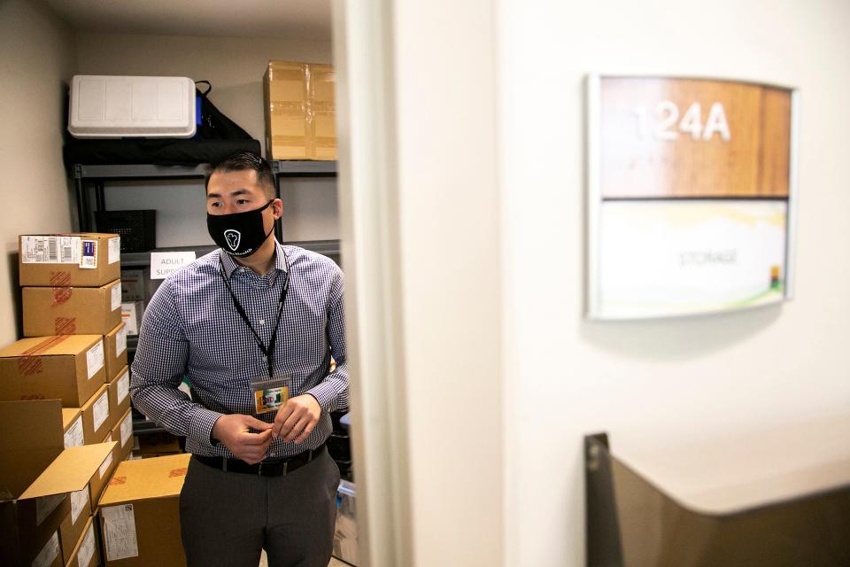 Sam Jarvis, Johnson County Public Health community health division manager, talks about items in the department's storage area, Wednesday, Dec. 8, 2021, in his office at the Johnson County Public Health building in Iowa City, Iowa.