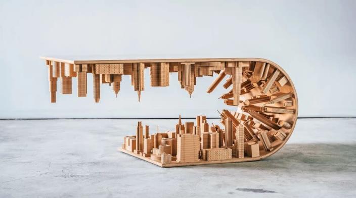 Mousarris Design Studio&#39;s Wave City Coffee Table sees a cityscape folded upwards over itself, much like in the 2010 hit film 