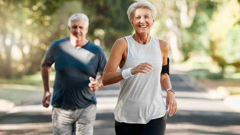 older couple running and smiling