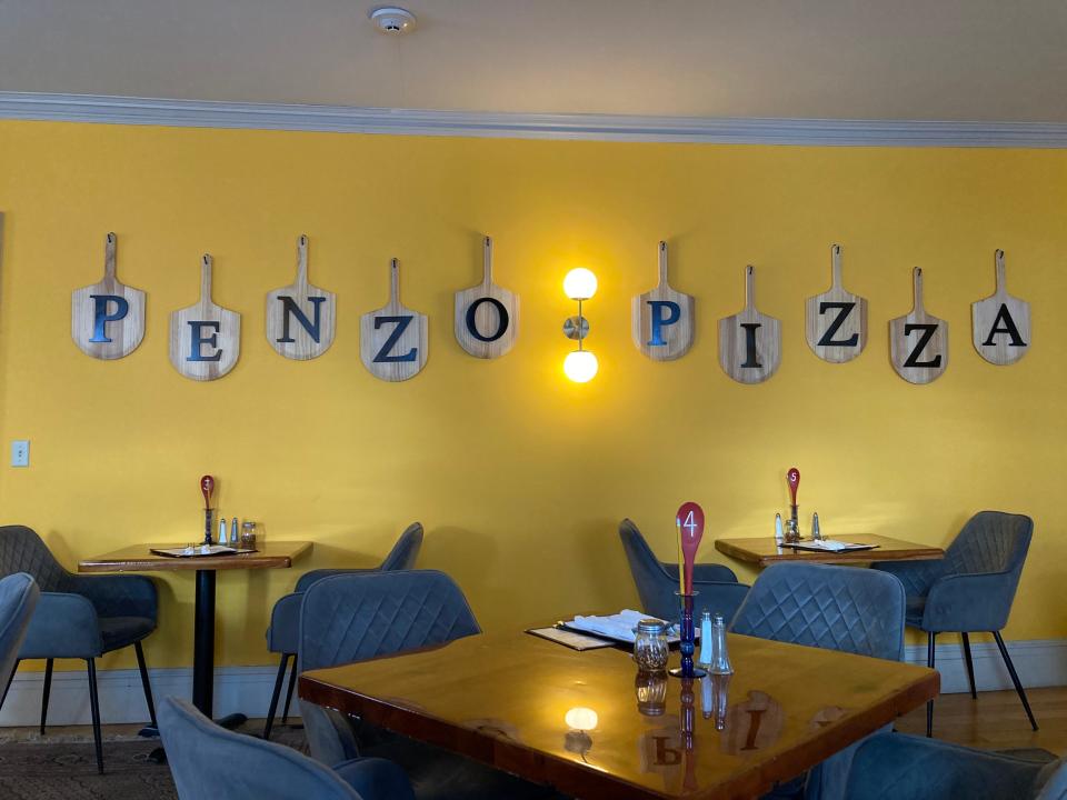 Pizza paddles adorn the wall March 8, 2023 at Penzo Pizza Co. in Montpelier.