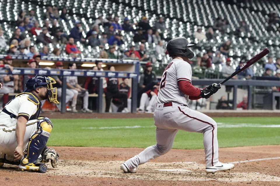 Arizona Diamondbacks' Daulton Varsho hits an RBI single during the 10th inning of a baseball game against the Milwaukee Brewers Monday, Oct. 3, 2022, in Milwaukee. (AP Photo/Morry Gash)