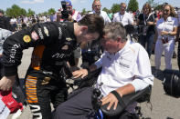 Pato O'Ward celebrates with a team owner Sam Schmidt after winning the second race of the IndyCar Detroit Grand Prix auto racing doubleheader on Belle Isle in Detroit Sunday, June 13, 2021. (AP Photo/Paul Sancya)