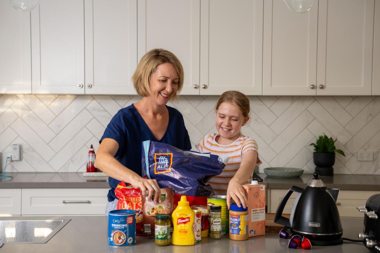 <span>Angela Murray-Gilbert and daughter Isla at home in Brisbane. Murray-Gilbert says friends and family call her ‘Queen Aldi’ for her deep love of the supermarket.</span><span>Photograph: Rhett Hammerton/The Guardian</span>