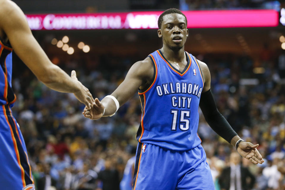 Oklahoma City Thunder guard Reggie Jackson is congratulated after making a free throw in the final seconds of overtime in Game 4 of an opening-round NBA basketball playoff series against the Memphis Grizzlies Saturday, April 26, 2014, in Memphis, Tenn. Jackson scored 32 points as Oklahoma City won 92-89. (AP Photo/Mark Humphrey)