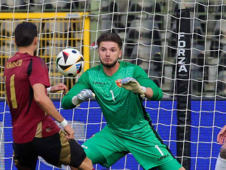 Montenegro goalkeeper Matija Sarkic in action against Belgium (EPA)