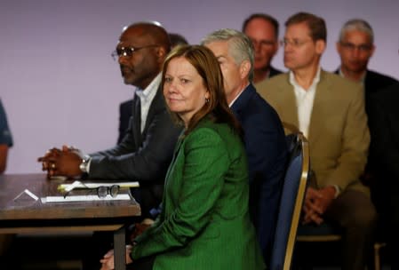 General Motors Chairman and CEO Mary Barra waits for the ceremonial hand shake with United Auto Workers President Gary Jones (not pictured) at the start of contract talks between the union and automaker in Detroit,