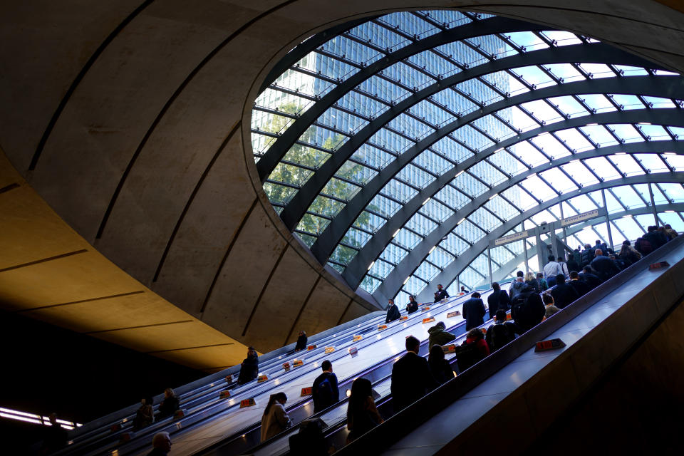 <p>Office workers and commuters use an escalator in Canary Wharf tube station, in London, during the morning rush hour. Picture date: Wednesday October 6, 2021.</p>
