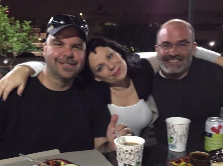 Walton, Smyth and Walton's husband, Pablito, hanging out in the BBQ area of their apartment complex (2015). (Photo: Courtesy of Johnathan Walton)