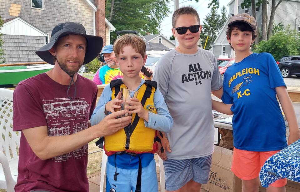 First place winners of the first GBYC Ned McIntosh MerryMac Regatta held on July 16 are, left to right, Matt and Arthur Glenn, Jack Mayuski and Damien Hattan.