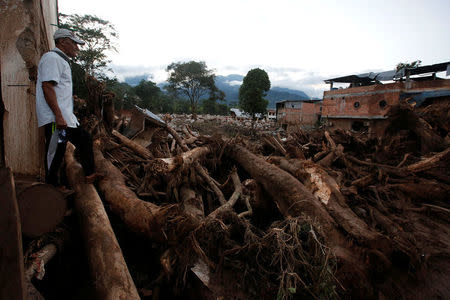 A man looks at a destroyed area after heavy rains caused several rivers to overflow, pushing sediment and rocks into buildings and roads in Mocoa, Colombia April 1, 2017. REUTERS/Jaime Saldarriaga