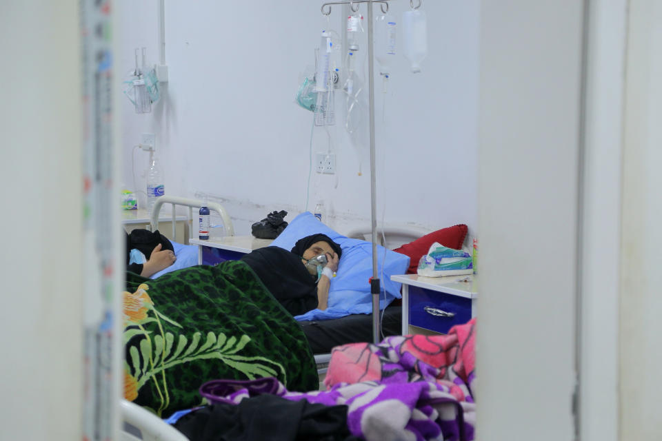 A coronavirus patient receives treatment at a hospital in Najaf, Iraq, Wednesday, July 14, 2021. Infections in Iraq have surged to record highs amid a third wave spurred by the more aggressive delta variant, and long-neglected hospitals suffering the effects of decades of war are overwhelmed with severely ill patients. (AP Photo/Anmar Khalil)