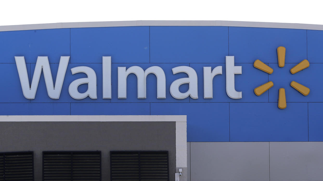 A Walmart logo is displayed outside a store. (AP)