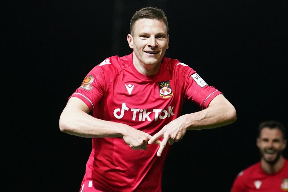 Paul Mullin celebrates while playing for Wrexham (PA Wire)