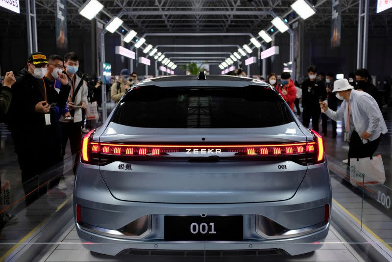 FILE PHOTO: Visitors check a Zeekr 001, a model from Geely's new brand Zeekr, at its factory in Ningbo